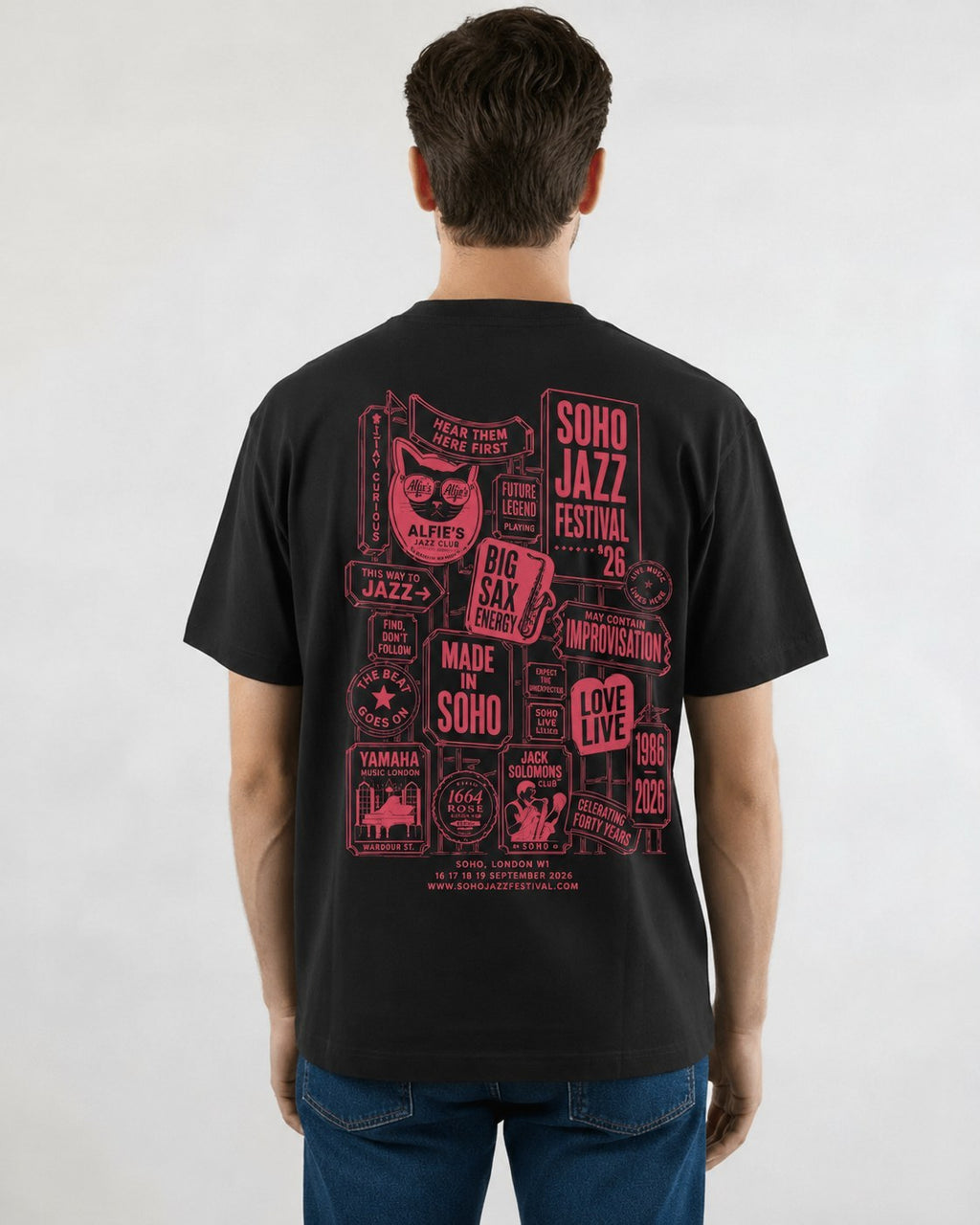 The '26 Tee in vintage black, back print of the Soho Jazz Festival sign stack in watermelon