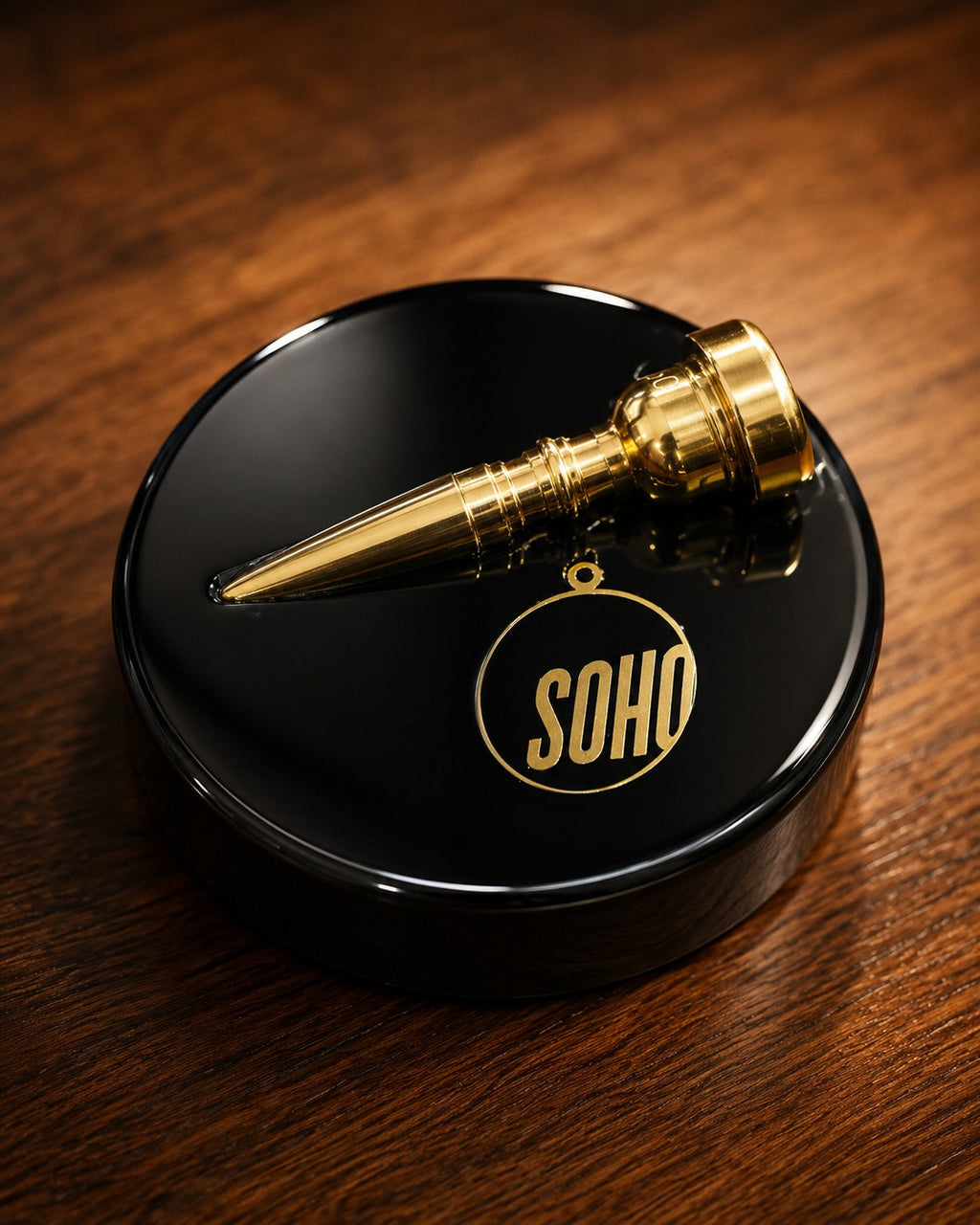 Top Brass, a brass trumpet mouthpiece and Soho key plaque set in a black piano gloss resin disc